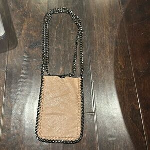 Light pink cross body bag.